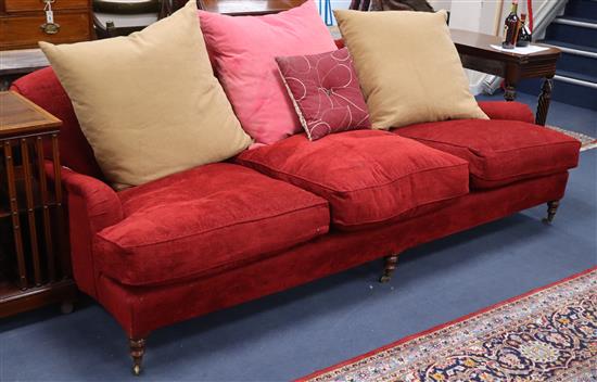 A large red chenille three seat sofa 240cm long